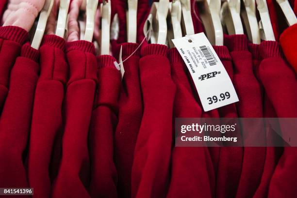 Rand price sign hangs from a rail of children's clothing inside PEP retail store, operated by Pepkor Ltd., a unit of Steinhoff International Holdings...