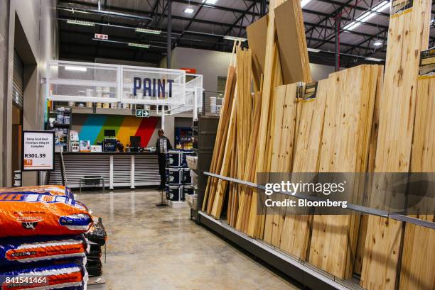 Lengths of cut timber sit on display inside a Timbercity store, operated by Steinhoff International Holdings NV, in Johannesburg, South Africa, on...