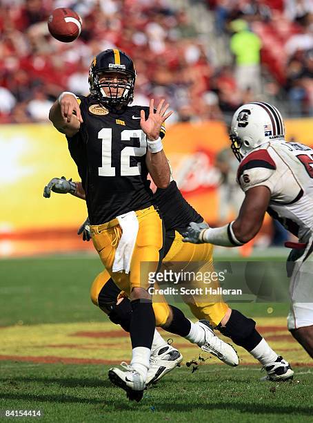 Ricky Stanzi of the Iowa Hawkeyes drops back to pass against the South Carolina Gamecocks during the Outback Bowl on January 1, 2009 at Raymond James...