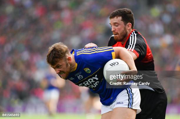 Dublin , Ireland - 26 August 2017; Barry John Keane of Kerry is tackled by Chris Barrett of Mayo during the GAA Football All-Ireland Senior...