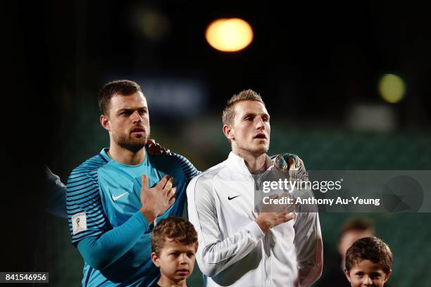 Captain Chris Wood and goal keeper Stefan Marinovic of New Zealand sing the national anthem prior to the 2018 FIFA World Cup Qualifier match between...