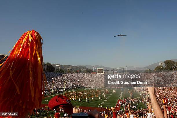Fans cheer as a B1 bomber flies over the stadium before the start of of the the 95th Rose Bowl Game presented by Citi between the Penn State Nittany...