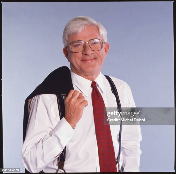 Portrait of American television personality Phil Donahue as he poses with his jacket over his shoulder, New York, New York, May 19, 1992. This photo...