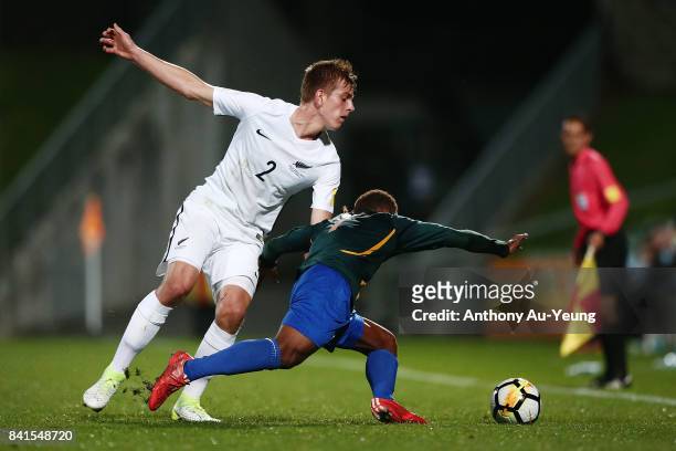 Sam Brotherton of New Zealand competes for the ball against Jerry Donga of Solomon Islands during the 2018 FIFA World Cup Qualifier match between the...