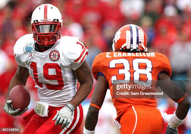 Quentin Castille of the Nebraska Cornhuskers attempts to allude the tackle of Chris Chancellor of the Clemson Tigers during the Konica Minolta Gator...