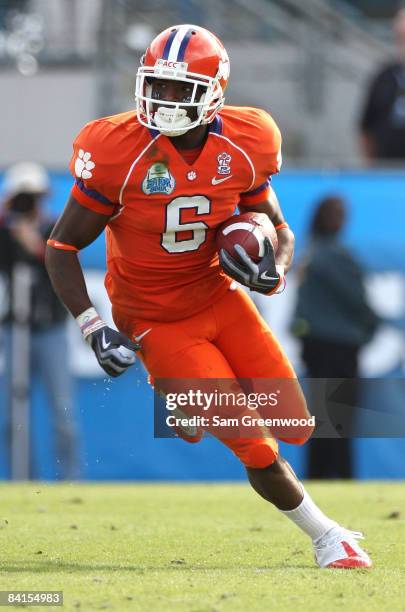 Jacoby Ford of the Clemson Tigers runs for yardage after a reception during the Konica Minolta Gator Bowl against the Nebraska Cornhuskers at...