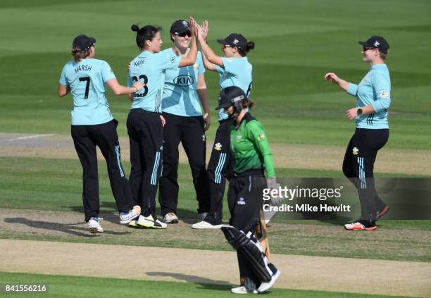 Marizanne Kapp of Surrey Stars celebrates with teammates after trapping Fran Wilson of Western Storm for zero during the Women's Kia Super League...