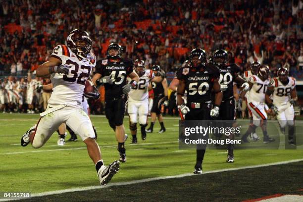 Darren Evans of the Virginia Tech Hokies scores a touchdown during the FedEx Orange Bowl against the Cincinnati Bearcats at Dolphin Stadium on...