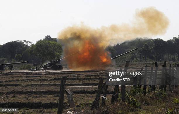 In this picture taken on September 22 Sri Lankan government troops fire artillery at Liberation Tamil Eelam Tiger rebels in Kilinochchi. Sri Lankan...
