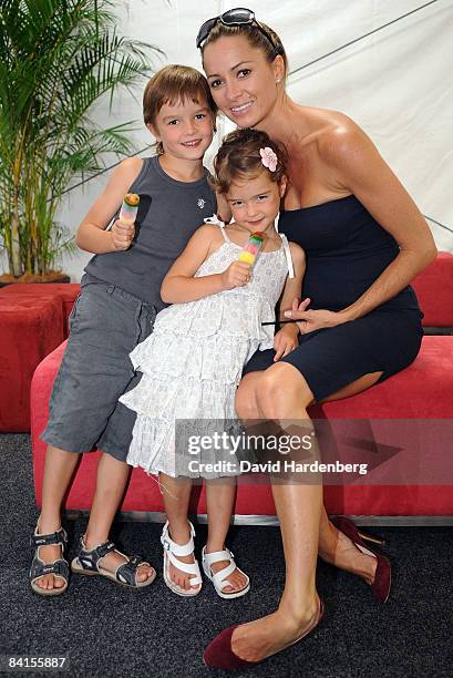 Lara Rafter poses with her children Joshua and India during the official launch of the Pat Rafter Arena at the Queensland Tennis Centre on January 2,...