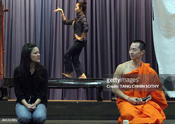 Actors Sam and Bopha perform during a rehearsal for a Broadway musical-style rock opera in Phnom Penh on November 14, 2008. Cambodian monks have...