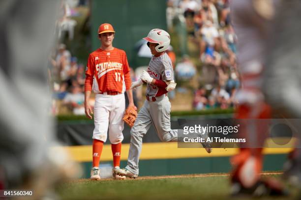 Little League World Series: Japan Region Keitaro Miyahara in action, rounding bases after hitting homerun vs USA Southwest Region during Championship...