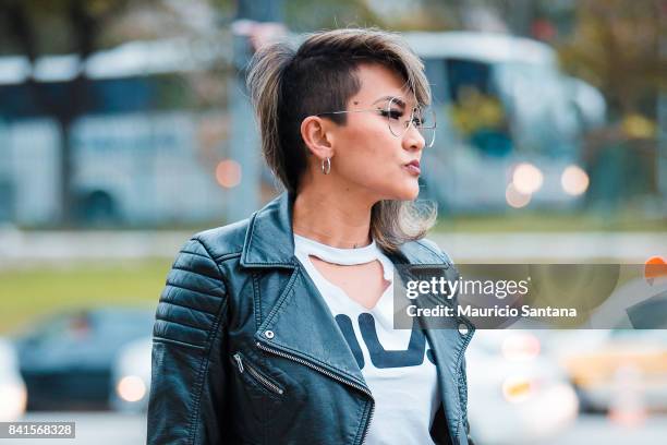 Visitor poses, fashion detail hairstyle during Sao Paulo Fashion Week N44 SPFW Winter 2018 at Ibirapuera's Bienal Pavilion on August 31, 2017 in Sao...
