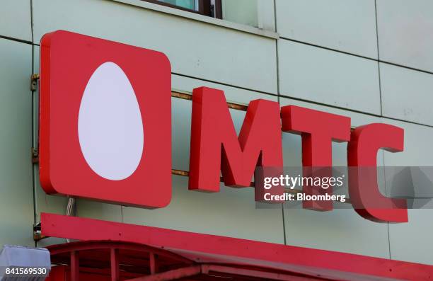 Logo sits on display outside a Mobile TeleSystems PJSC mobile communications store in Moscow, Russia, on Friday, Sept. 1, 2017. Billionaire Vladimir...