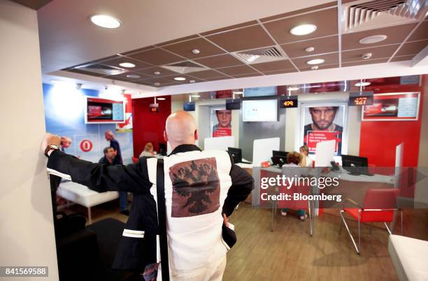 Customer waits to speak to a member of the service desk inside a Mobile TeleSystems PJSC mobile communications store in Moscow, Russia, on Friday,...
