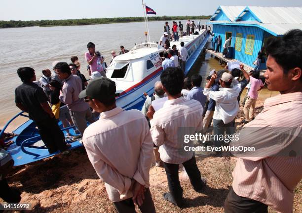 Tourists arriving with a speed boat from Phnom Penh at the port of Tonle Sap lake next to Siem Reap near Angkor Wat on December 25 Cambodia.The...