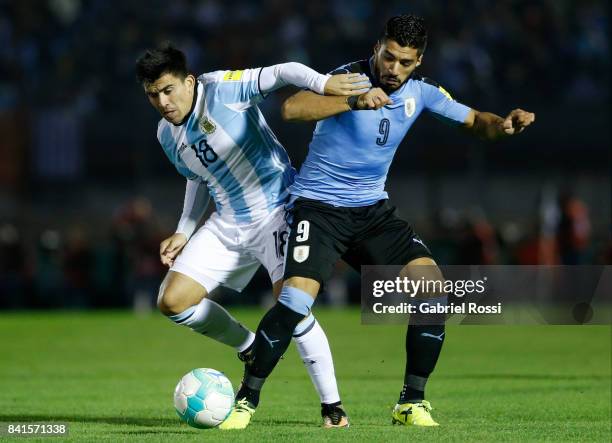 Marcos Acuña of Argentina fights for the ball with Luis Suarez of Uruguay during a match between Uruguay and Argentina as part of FIFA 2018 World Cup...