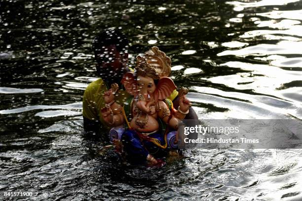 Devotees during the seventh day immersion of Ganesha idols at Vashi, on August 31, 2017 in Mumbai, India. Several devotees, who brought the idols,...