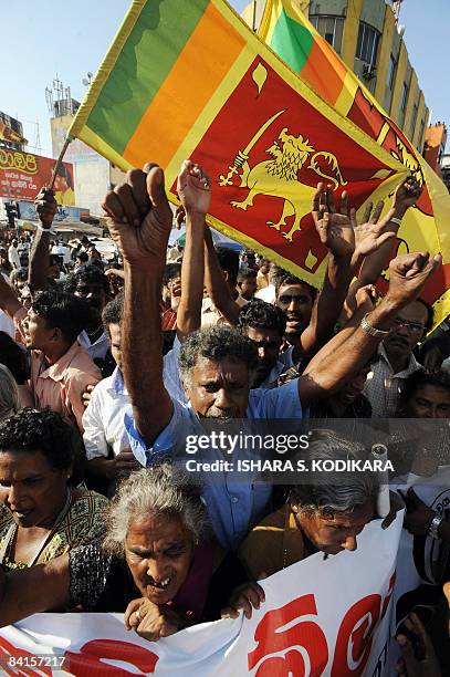 Sri Lankan wave the national flag in Colombo on January 02 to celebrate the military capturing the northern town of Kilinochchi on Friday. Ground...