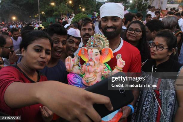 Devotees during the seventh day immersion of Ganesha idols at Rayladevi artificial Lake Thane, on August 31, 2017 in Mumbai, India. Several devotees,...