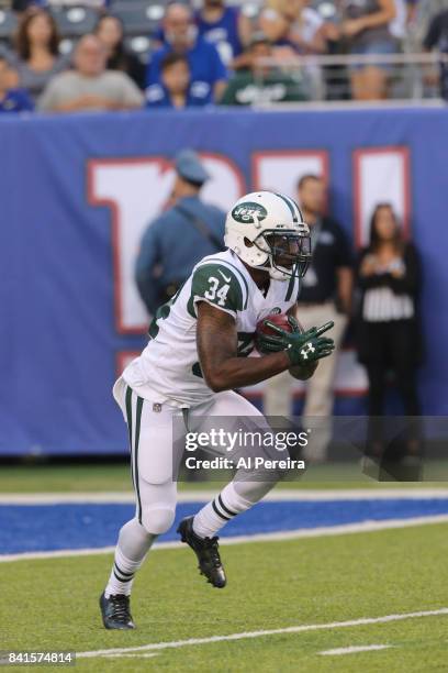 Running Back Marcus Murphy of the New York Jets has a long gain against the New York Giants during a preseason game on August 26, 2017 at MetLife...