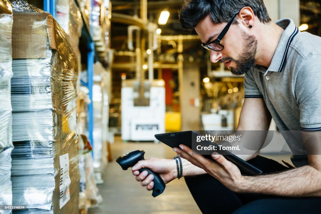Manual Worker With Bar Code Reader And Digital Tablet