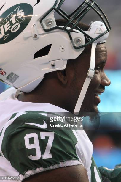 Defensive Lineman Lawrence Thomas of the New York Jets follows the action against the New York Giants during a preseason game on August 26, 2017 at...