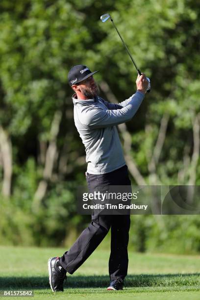 Graham DeLaet of Canada plays a shot on the tenth hole during round one of the Dell Technologies Championship at TPC Boston on September 1, 2017 in...