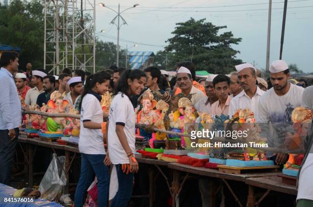 Residents of Kalyan choose to immerse Ganesha idols in artificial pond at Kolsewadi Police Station pond in Kalyan, on August 31, 2017 in Mumbai,...