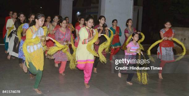 Women and children practice for immersion of Tilaknagar Ganesh Utsav Mandal in Dombivli, on August 31, 2017 in Mumbai, India. Several devotees, who...