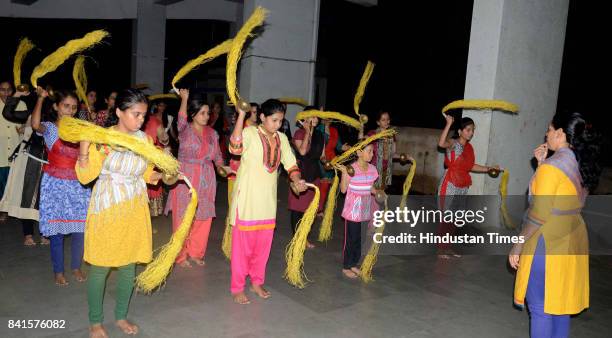 Women and children practice for immersion of Tilaknagar Ganesh Utsav Mandal in Dombivli, on August 31, 2017 in Mumbai, India. Several devotees, who...