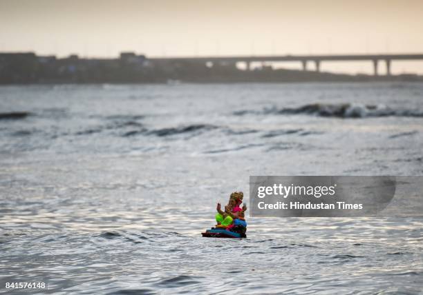 Devotees during the seventh day immersion of Ganesha idols at Dadar Chowpatty, on August 31, 2017 in Mumbai, India. Several devotees, who brought the...