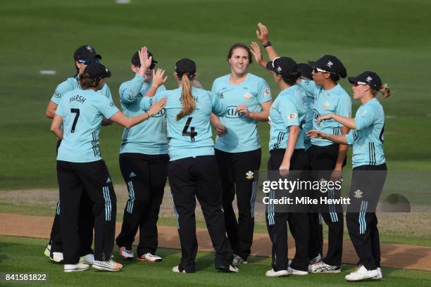 Natalie Sciver of Surrey Stars celebrates with teammates after dismissing Anya Shrubsole of Western Storm during the Women's Kia Super League Semi...