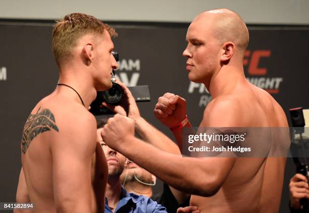 Opponents Alexander Volkov of Russia and Stefan Struve of The Netherlands face off during the UFC Fight Night Weigh-in at the Rotterdam Ahoy on...