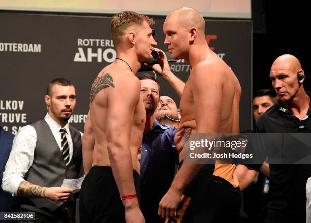 Opponents Alexander Volkov of Russia and Stefan Struve of The Netherlands face off during the UFC Fight Night Weigh-in at the Rotterdam Ahoy on...