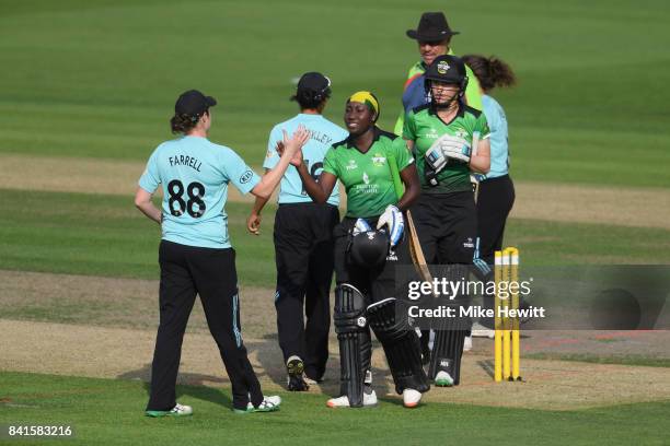 Player of the match Stafanie Taylor of Western Storm shakes hands with players of Surrey Stars after the victory in Women's Kia Super League Semi...