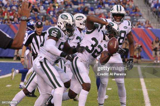 Cornerback Juston Burris of the New York Jets has an interception against the New York Giants during a preseason game on August 26, 2017 at MetLife...