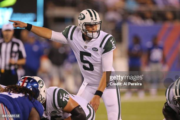 Quarterback Christian Hackenberg of the New York Jets calls a play against the New York Giants during a preseason game on August 26, 2017 at MetLife...