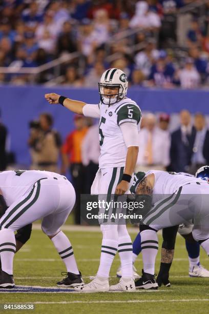 Quarterback Christian Hackenberg of the New York Jets calls a play against the New York Giants during a preseason game on August 26, 2017 at MetLife...