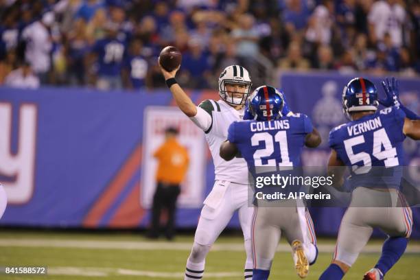 Quarterback Christian Hackenberg of the New York Jets passes the ball against the New York Giants during a preseason game on August 26, 2017 at...