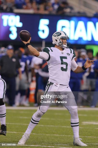 Quarterback Christian Hackenberg of the New York Jets passes the ball against the New York Giants during a preseason game on August 26, 2017 at...