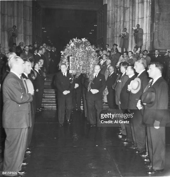 The body of American baseball player Babe Ruth is carried in a casket from St. Patrick's Cathedral as New York City Mayor William O'Dwyer and New...
