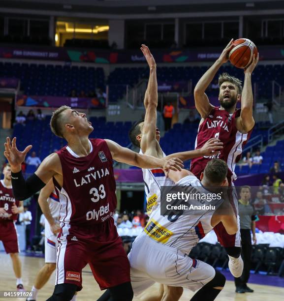 Vladimir Stimac of Serbia in action against Zanis Peiners of Latvia during the FIBA Eurobasket 2017 Group D Men's basketball match between Serbia and...