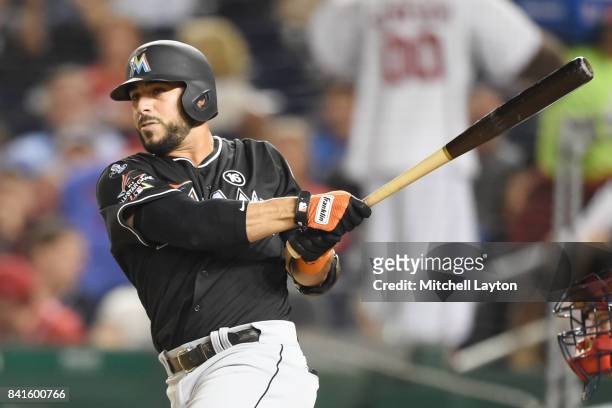 Mike Aviles of the Miami Marlins takes a swing during a baseball game against the Washington Nationals at Nationals Park on August 28, 2017 in...