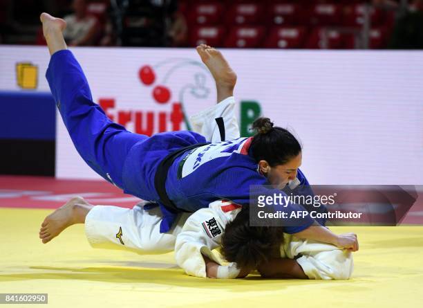 Gold medalist in the womens -78kg category Brasil's Mayra Aguiar competes with Japan's Mami Umeki at the World Judo Championships in Budapest on...