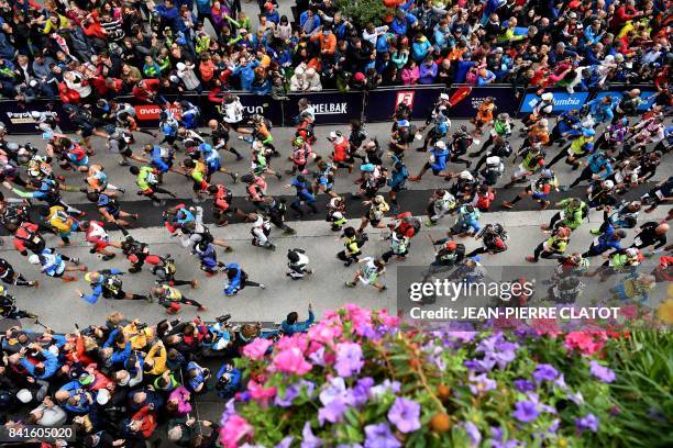 Runners take the start of the 170 km Mount Blanc Ultra Trail race around the Mont-Blanc crossing France, Italy and Swiss, on September 1, 2017 in...