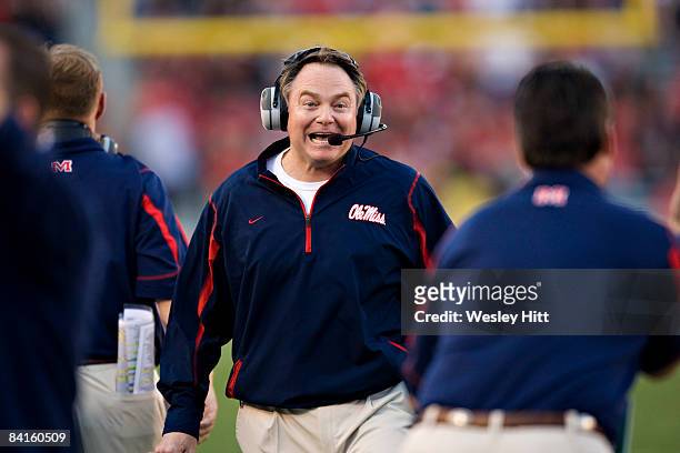 Head Coach Houston Nutt of the Ole Miss Rebels celebrates near the end of the game against the Texas Tech Red Raiders during the AT&TCotton Bowl on...