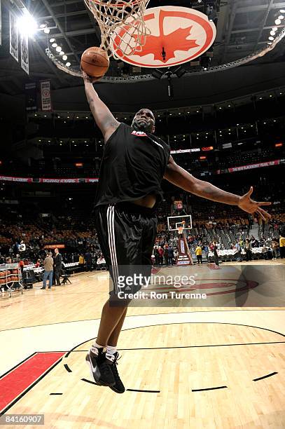 Nathan Jawai of the Toronto Raptors winds up for a dunk during practice prior to a game against the Houston Rockets on January 2, 2009 at the Air...
