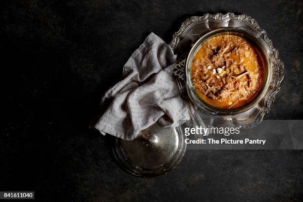 an indian meat curry with rice, served in silver bowls - indian food bowls stock-fotos und bilder