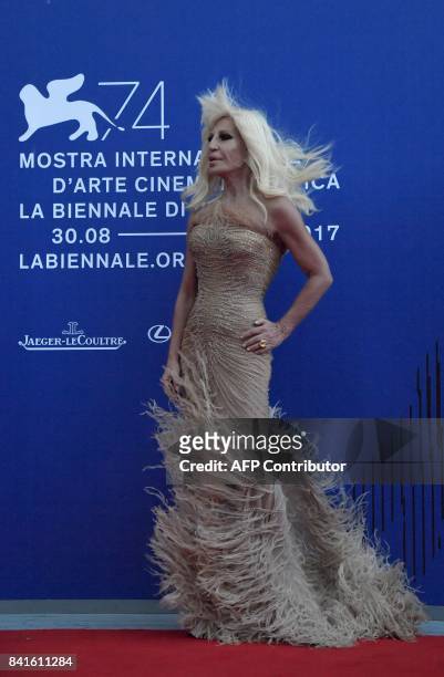 Italian designer Donatella Versace attends the "Franca Sozzani Award" during the 74th Venice Film Festival on September 1, 2017 at Venice Lido. / AFP...